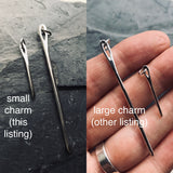 Small silver needle charm