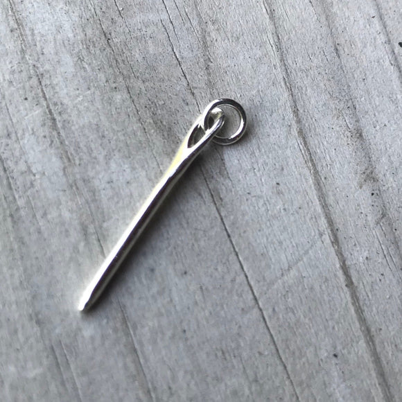 Small silver needle charm