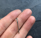 Small silver needle charm