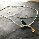 Bird necklace with dangling flower