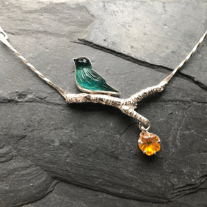 Bird necklace with dangling flower